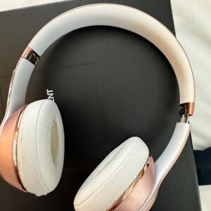 Beats rose gold head phones.